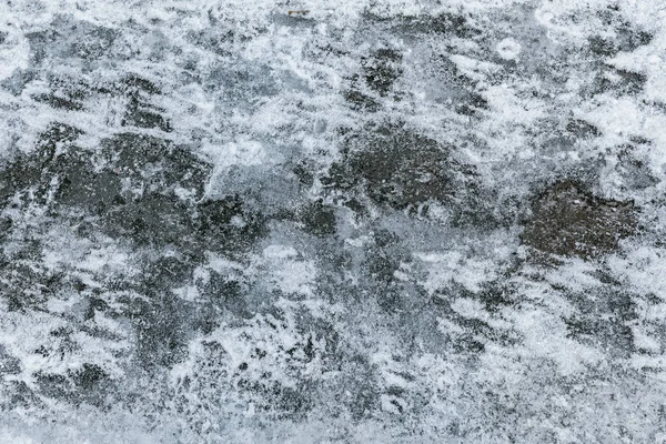 Hintergrundstruktur Aus Rauem Asphalt Mit Schmelzendem Schnee Und Eis — Stockfoto