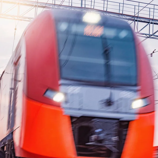 Passenger train moves fast at sunset time. — Stock Photo, Image