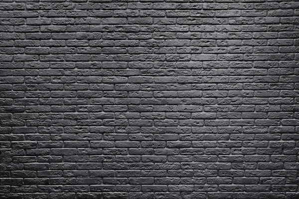 Gray brick wall background inside of the room.