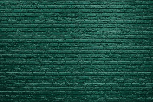 Grüne Backsteinmauer Hintergrund. — Stockfoto