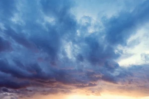 Dark clouds after rain at sunset time. — Stock Photo, Image