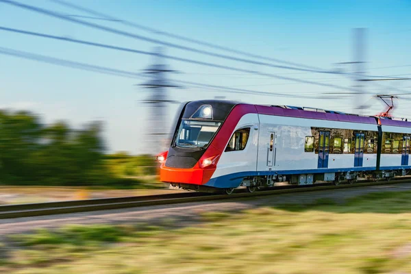 Modern high-speed train moves fast sunny day time. — Stock Photo, Image