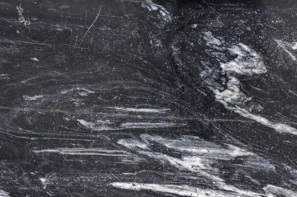 dark gray marble texture with scratches. Natural patterned stone for background, copy space and design. Abstract marble stone surface. Gray color, backdrop