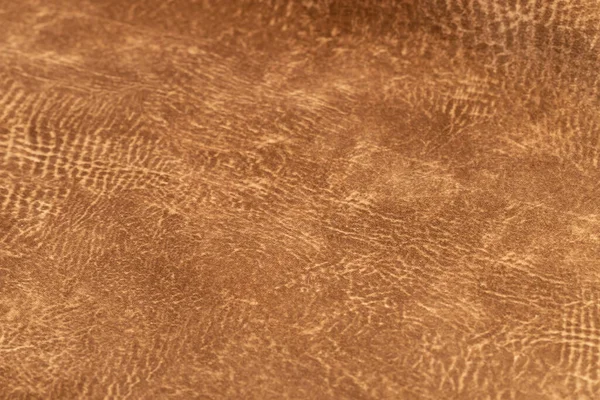 brown faux suede leather for the concept and style idea of fine leather craft, handmade work space. Background textures and Wallpapers.