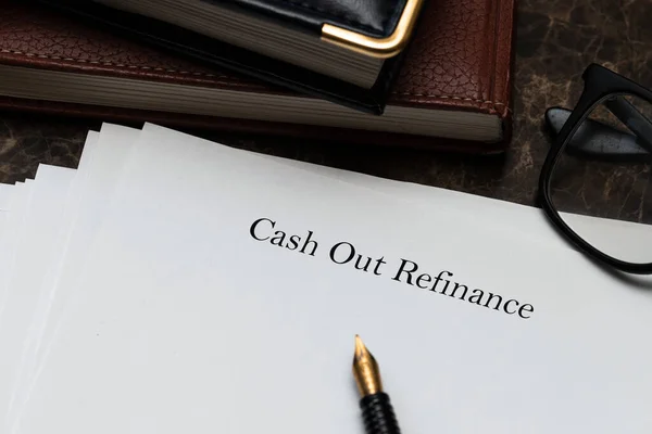 Cash out refinance text on documents on table
