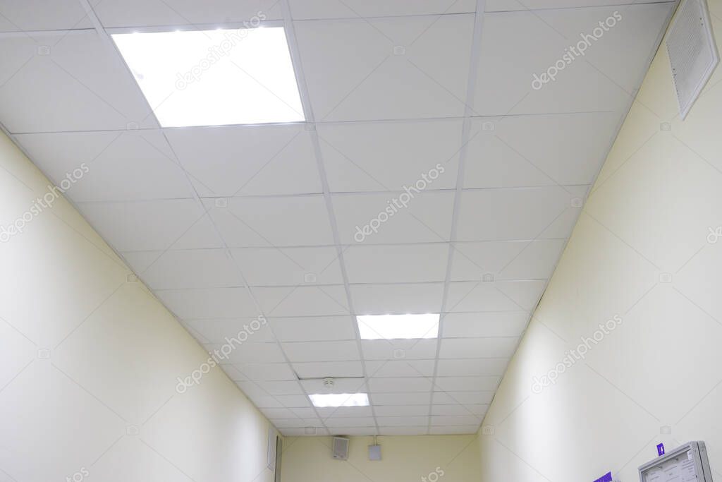 Suspended Grid False Ceiling Interior View Or Design For An Office Or Kitchen Roof Using Square Shaped Calcium Silicate Board Abstract Empty White Interior Space With Office Lights Copy Space Larastock Suspended Grid False Ceiling Interior View Or Design For An Office Or Kitchen Roof Using Square Shaped Calcium Silicate Board Abstract Empty White Interior Space With Office Lights Copy Space Larastock
