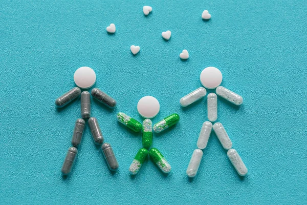 Creative Healthcare Concept Made Drugs Pills Family Holding Hands Blue — Stock Photo, Image