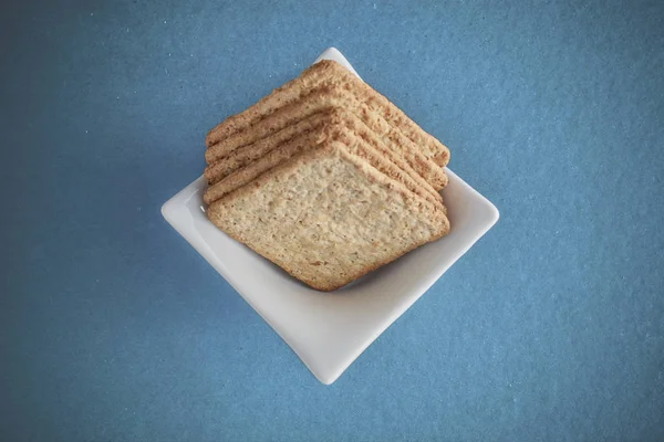 wholemeal cookies grouped on blue background