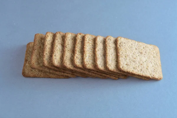wholemeal cookies grouped on blue background