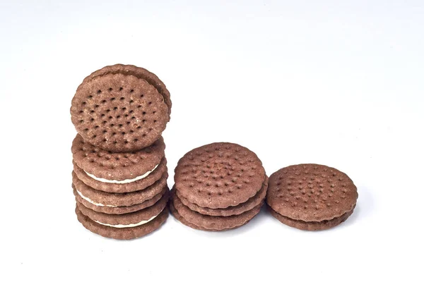 Stuffed chocolate cookies on white background