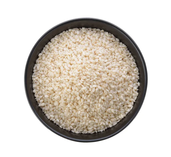 Beyaz zemin üzerinde bir kasede Beyaz Susam