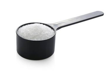 monosodium glutamate in spoon on white background clipart