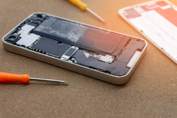 Closeup of phone battery repairs for smartphone By professional technician