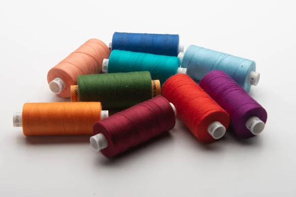 Rainbow colored sewing thread lined — Stock Photo, Image