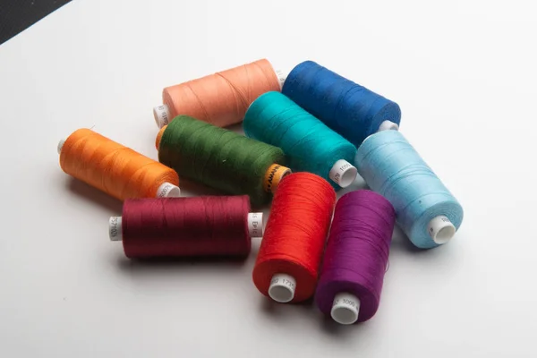 Rainbow colored sewing thread lined — Stock Photo, Image