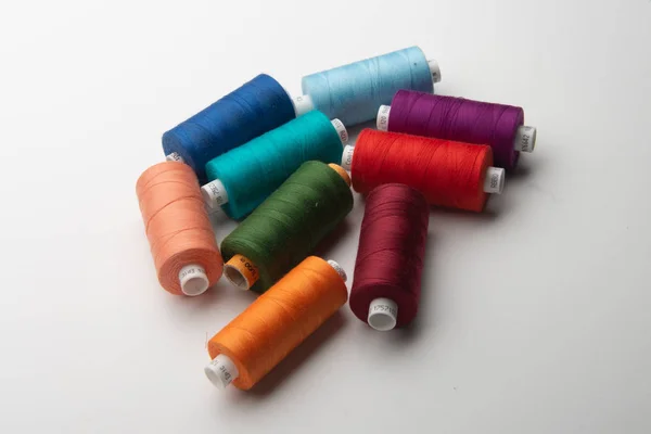 Rainbow colored sewing thread lined — Stock Photo, Image