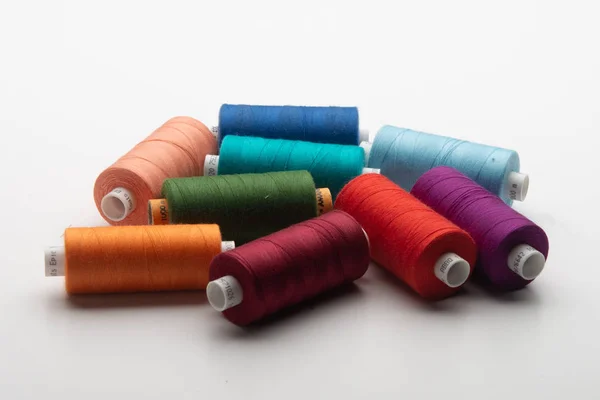 Rainbow colored sewing thread lined — Stock Photo, Image