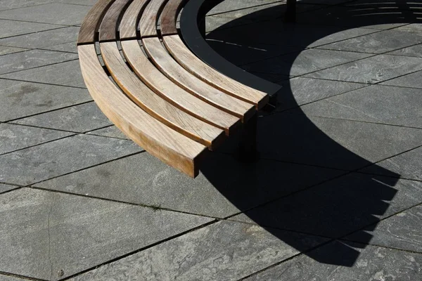 Wooden modern design round circular park bench — Stock Photo, Image