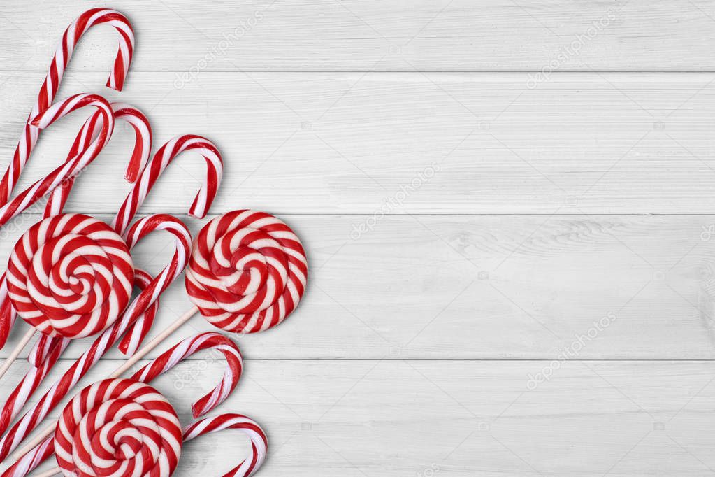 Christmas candies on white wooden background