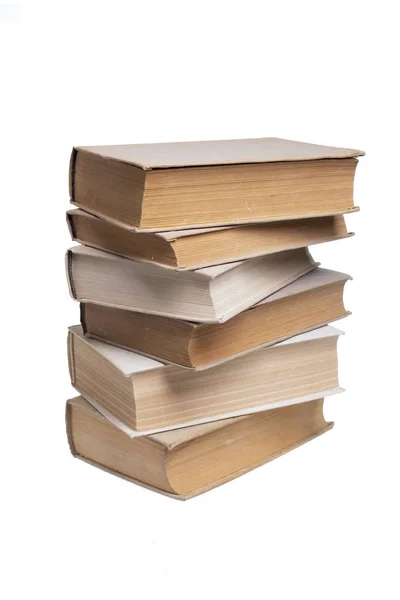 Pila di vecchi libri su sfondo bianco — Foto Stock