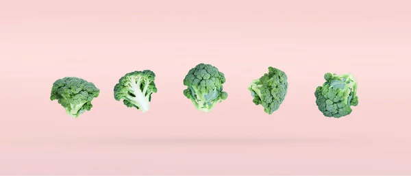 Five Broccoli Soar Freely Pink Background Casting Slight Shadow Creative — ストック写真