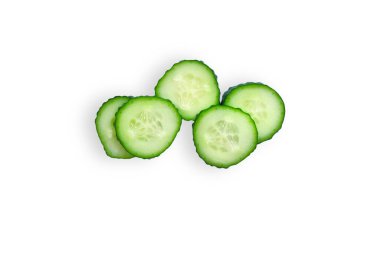 Several sliced organic cucumber slices isolated on a white background. The concept of freshness, juiciness. Top view.