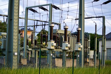 Power transformer in high voltage switchyard in modern electrical substation in Hesse, Germany clipart