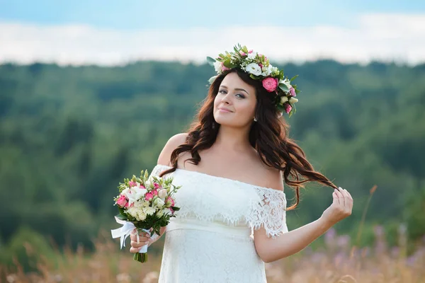 Brunette girl with a floral wreath — Stock Photo, Image