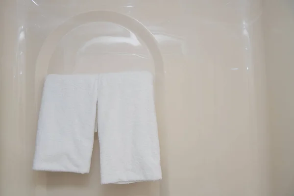 White bath towel hanging in the bathroom — Stock Photo, Image