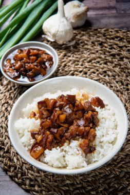 braised pork on rice is Minced pork served with pickles on top of steamed rice (minced pork rice) clipart
