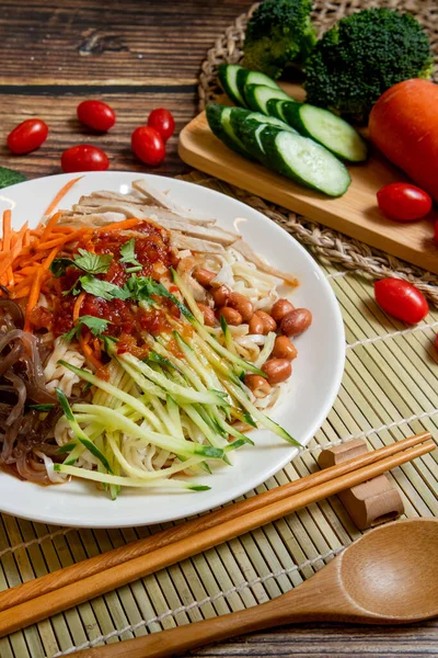 Yunnan-Style Cold Noodles, This tangle of cold noodles and vegetables in a sweet, sour, and savory sauce.