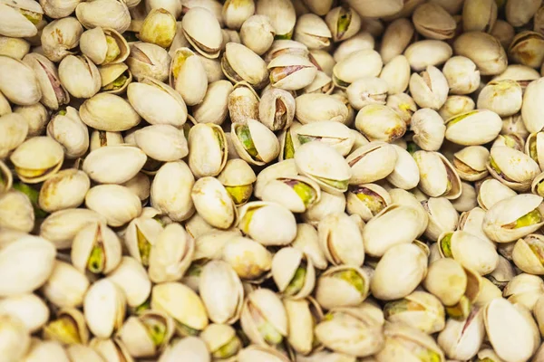 Pistachios, toasted and salted pistachios. Nut wallpaper.