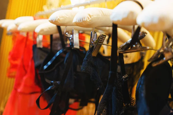 Attractive and seductive lingerie on a hanger in a women\'s clothing store.