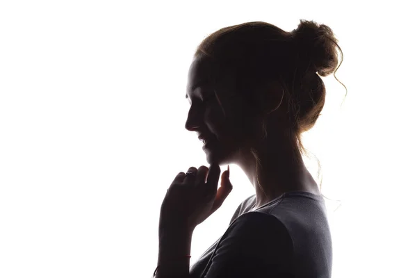 Silhueta de menina concurso sincero, perfil de rosto uma jovem mulher feliz em um fundo isolado branco, conceito de adolescência — Fotografia de Stock