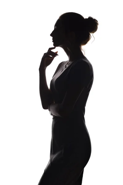 Profile of beautiful girl with hand-picked hair, silhouette of a woman on a white isolated background — Stock Photo, Image