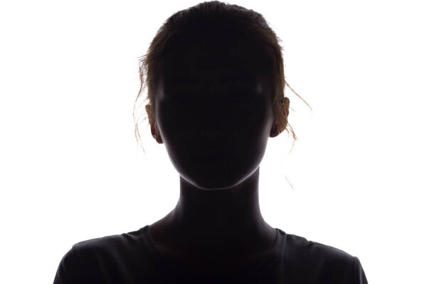 silhouette of a girl confidently looking forward, a young woman's head with a curl on a white isolated background