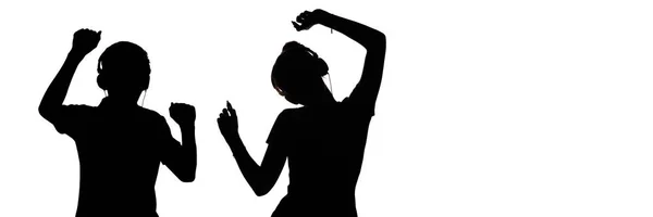 Σιλουέτα των εφήβων στα ακουστικά ακούγοντας μουσική, ο τύπος και το κορίτσι χορεύουν με τα χέρια ψηλά, την έννοια του Κόμματος και τον τρόπο ζωής των νέων σε ένα λευκό απομονωμένο φόντο — Φωτογραφία Αρχείου