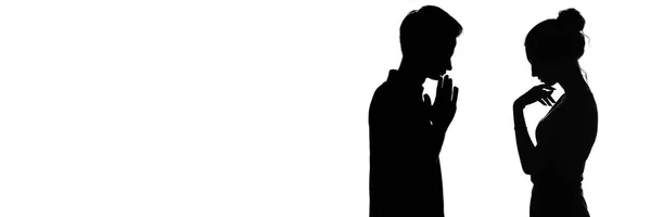 Silhouette profile of pensive young man and woman opposite each other, upset boy and a girl , concept of love and relationships on a white isolated background — Stock Photo, Image