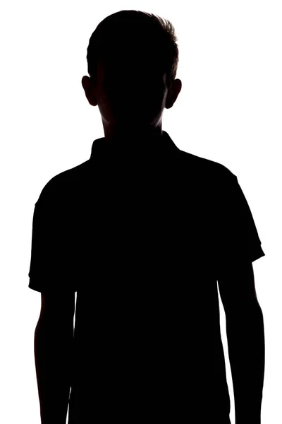 Silhouette di un giovane irriconoscibile, adolescente su uno sfondo bianco isolato — Foto Stock