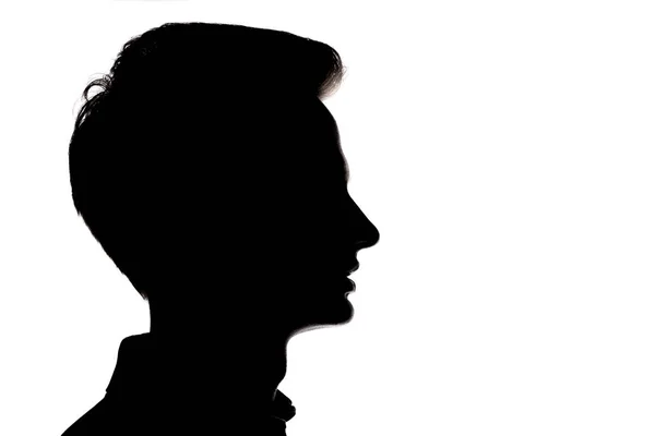 Silhouette av Young man Face profil på en vit isolerad backgro — Stockfoto