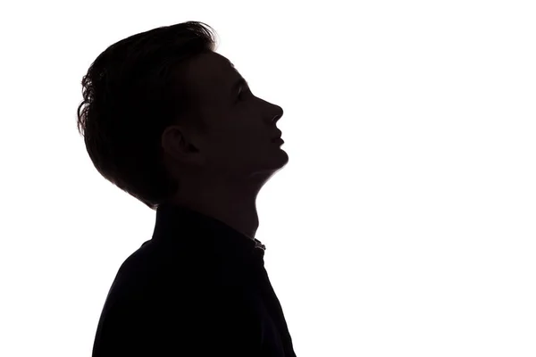 Silhouet van doordachte kerel, man gezicht profiel op een witte geïsoleerde achtergrond — Stockfoto