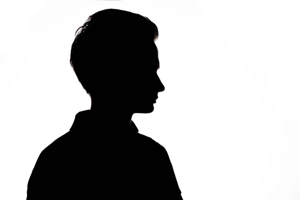 Silhouet van een onherkenbaar vent, man gezicht profiel op een witte geïsoleerde achtergrond — Stockfoto