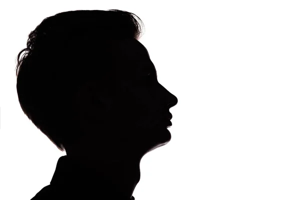 Silhueta de um cara irreconhecível, homem rosto perfil em um fundo isolado branco — Fotografia de Stock