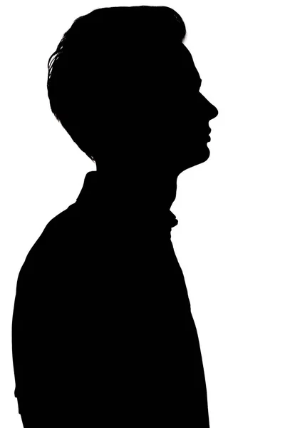 Silhouette noire et blanche d'un gars regardant attentivement vers le haut, profil de jeune homme — Photo