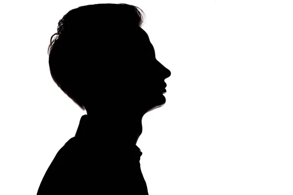 Horizontal black and white silhouette portrait of an unrecognizable guy thoughtfully looking up,young man face profile on a white isolated background — Stock Photo, Image