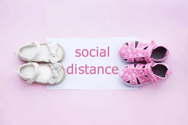 Social distance. Children\'s shoes at a distance from each other for social distance, increasing the physical space between people to avoid the spread of the disease during transmission of the COVID-19 outbreak