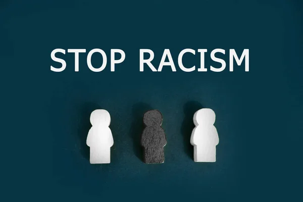 Black and white figures of people on a black background. The inscription in chalk-Stop racism. Black lives matter Motivational poster against racism and discrimination.