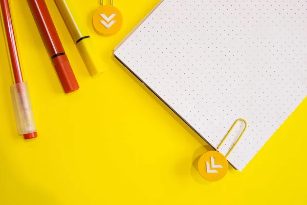 School supplies. Yellow and red colors. Flat lay composition. Yellow background. Space for text. Back to school.