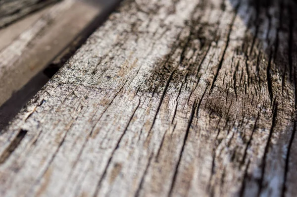 stock image Wooden board with cracks and veins of different colors.