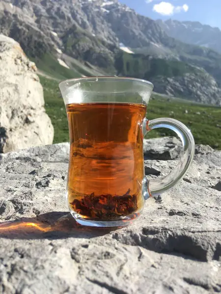 Glass of Turkish tea on the mountain, camping